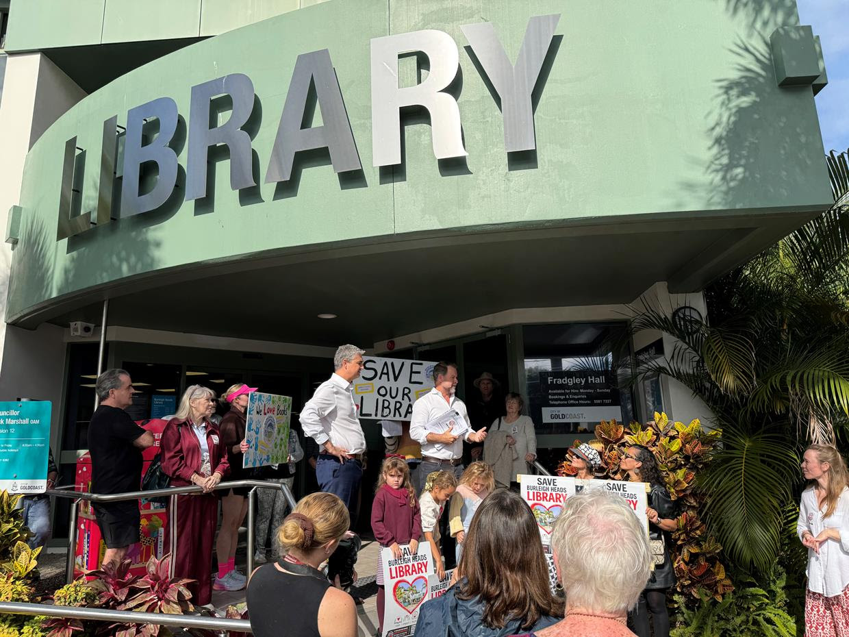 Campaigners and children gathered outside Burleigh Heads Library holding 'Save Our Library' signs